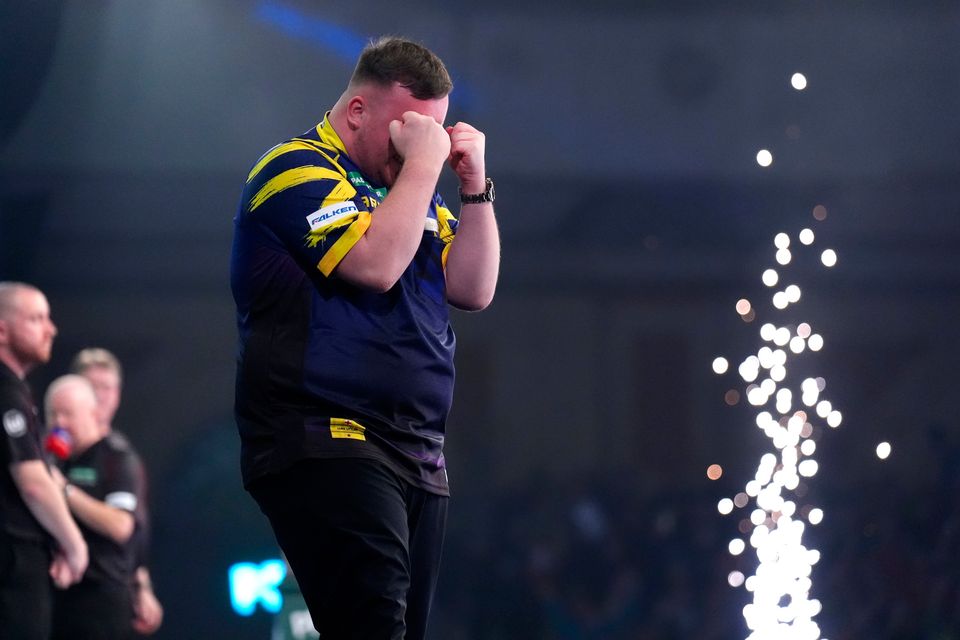 Luke Littler celebrates victory against Gian van Veen after the final of the World Darts Championship at the Alexandra Palace, London